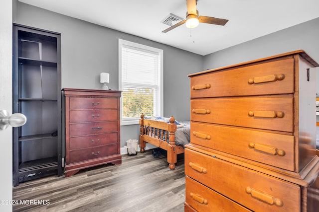 bedroom with wood-type flooring and ceiling fan