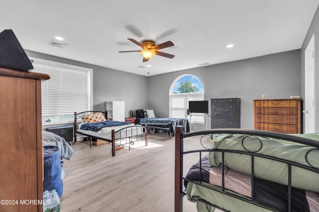 bedroom featuring light hardwood / wood-style flooring and ceiling fan