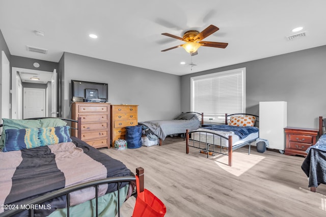 bedroom with light wood-type flooring and ceiling fan