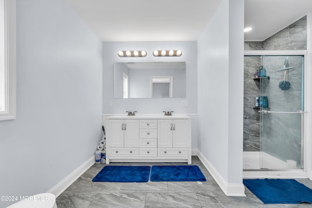 bathroom with vanity and an enclosed shower