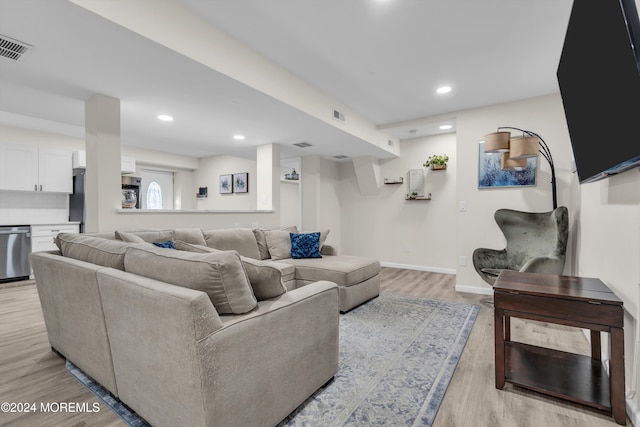 living room with light hardwood / wood-style flooring