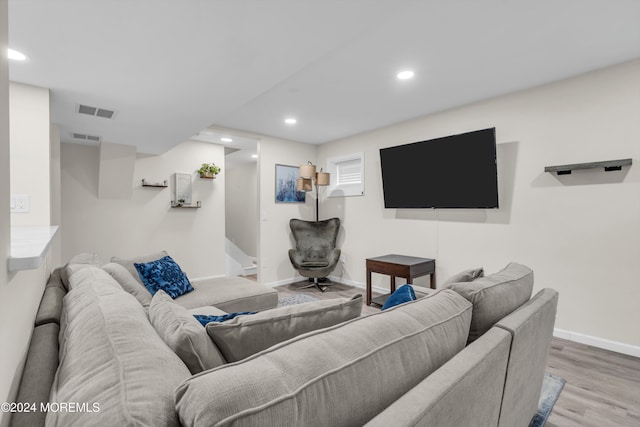 living room with light hardwood / wood-style flooring