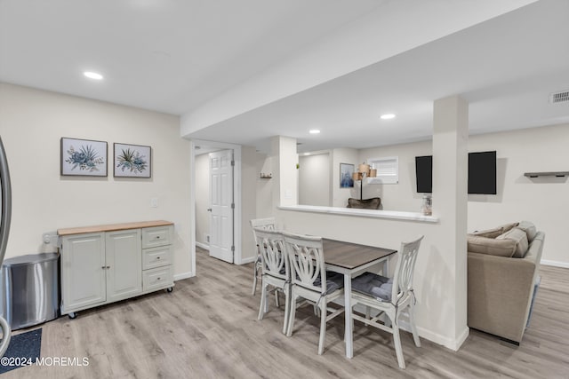 dining room with light wood-type flooring