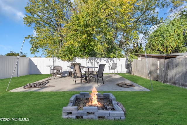 view of yard featuring a patio area and a fire pit