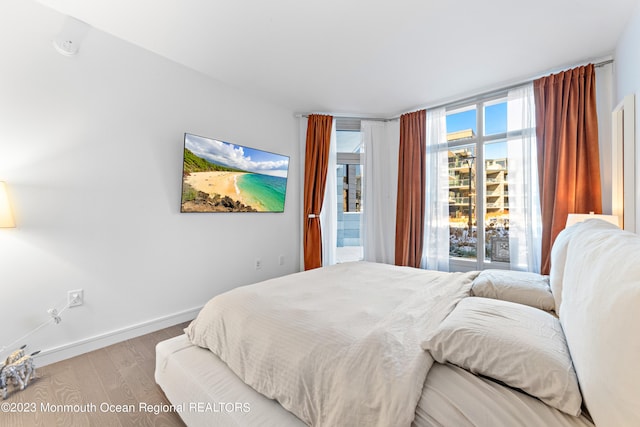 bedroom with light hardwood / wood-style floors