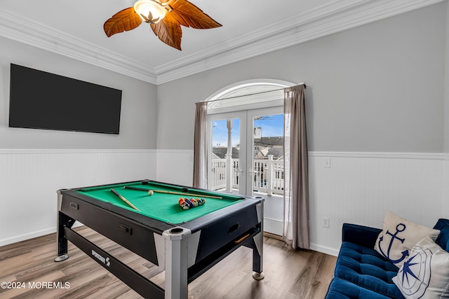 playroom with french doors, ornamental molding, hardwood / wood-style flooring, and ceiling fan