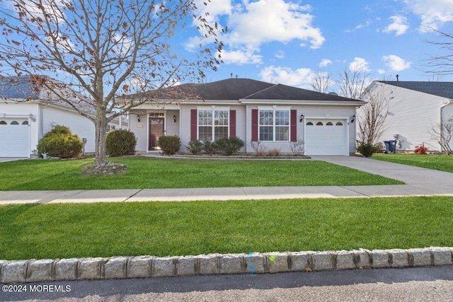 ranch-style home with a front yard and a garage