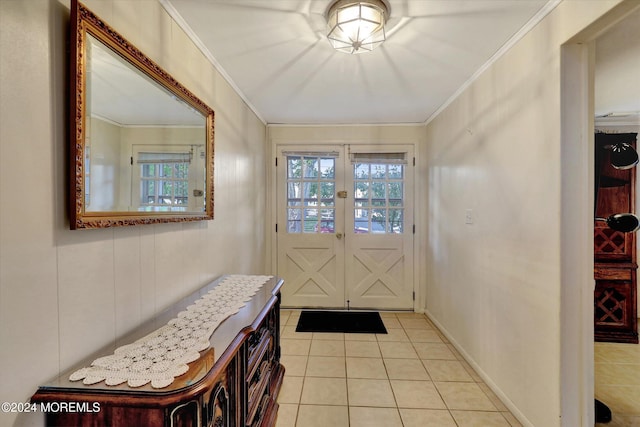 tiled entrance foyer with french doors and ornamental molding