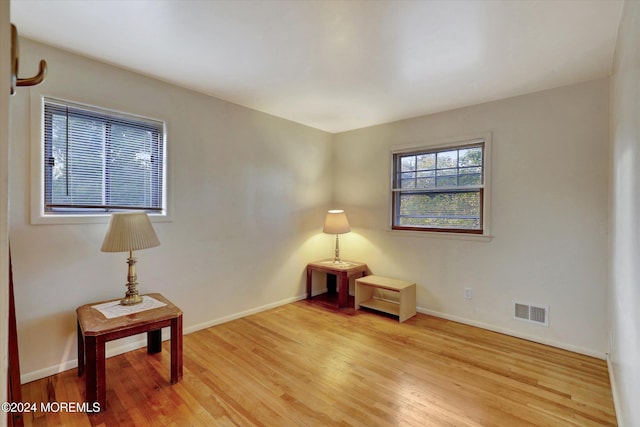 sitting room featuring light hardwood / wood-style flooring