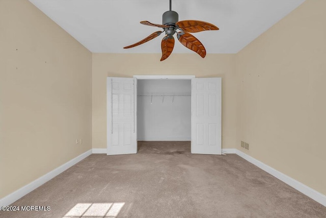 unfurnished bedroom featuring a closet, carpet flooring, visible vents, and baseboards