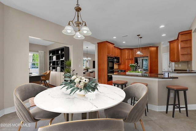 dining room with light tile patterned floors, recessed lighting, visible vents, baseboards, and an inviting chandelier