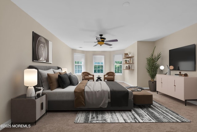 bedroom featuring carpet floors, baseboards, and a ceiling fan