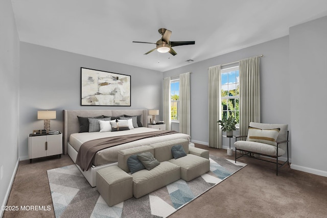 carpeted bedroom with ceiling fan and baseboards