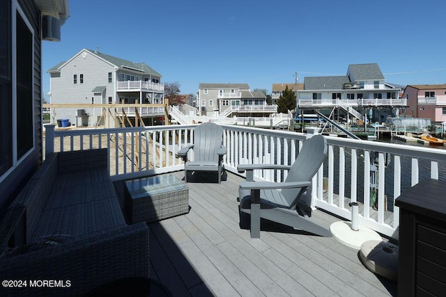 wooden terrace with a residential view