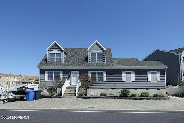 cape cod house with roof with shingles and crawl space