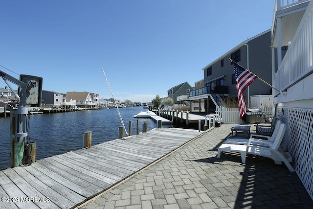 view of dock with a water view