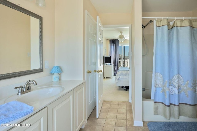 full bath featuring vanity, a ceiling fan, tile patterned floors, and shower / tub combo with curtain