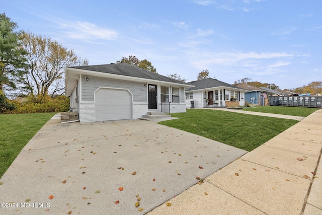 ranch-style home featuring a front yard and a garage