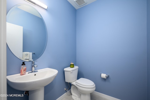 bathroom with toilet and sink