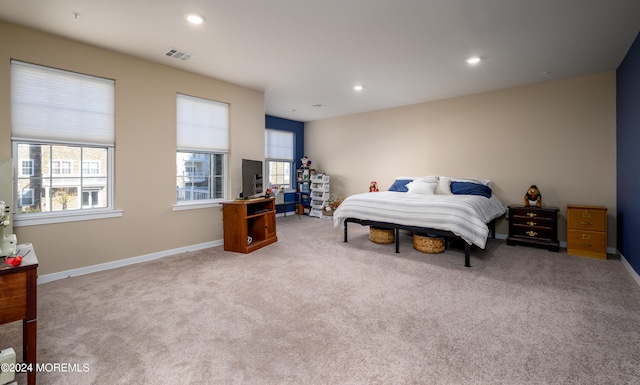 bedroom with light carpet