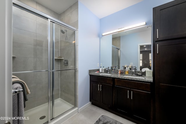 bathroom with vanity, tile patterned flooring, and an enclosed shower