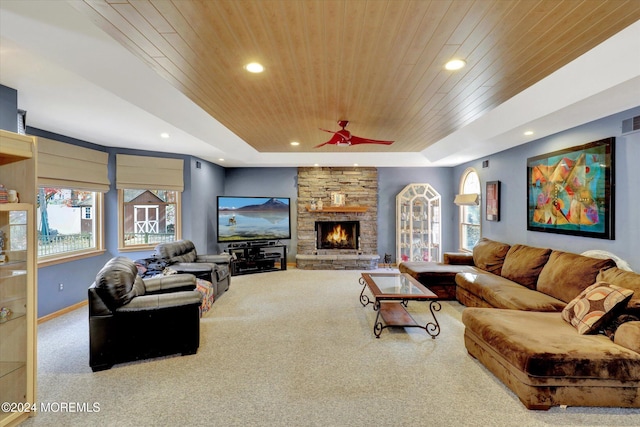 carpeted living room featuring plenty of natural light and wooden ceiling