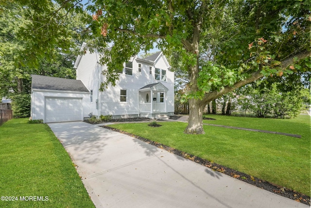 view of front of house featuring a garage and a front lawn