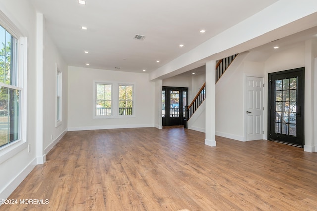 unfurnished living room featuring light hardwood / wood-style flooring