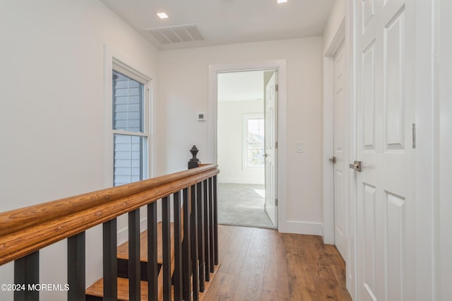 hall with wood-type flooring