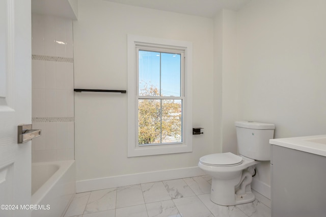 bathroom with toilet, vanity, and plenty of natural light