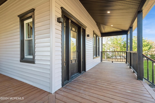 wooden terrace with a porch