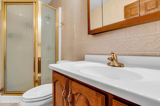 314 Ashford Rd, Toms River, NJ 08755 - bathroom featuring vanity, a stall shower, and tile walls