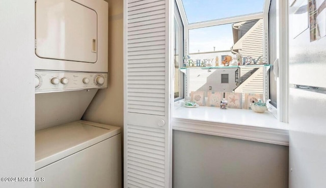 laundry room featuring stacked washer and dryer