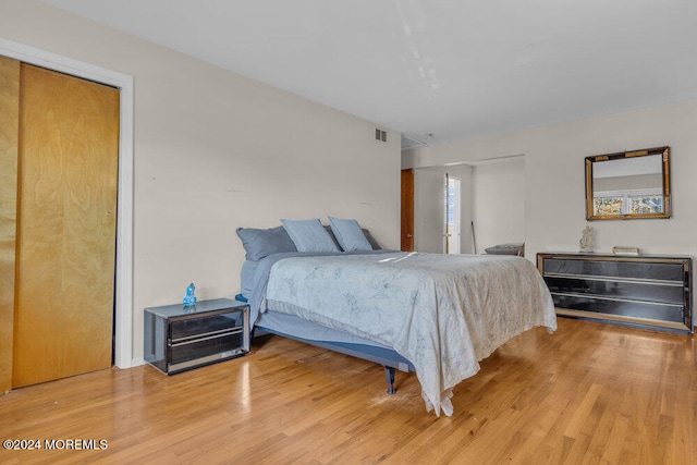 bedroom with hardwood / wood-style floors