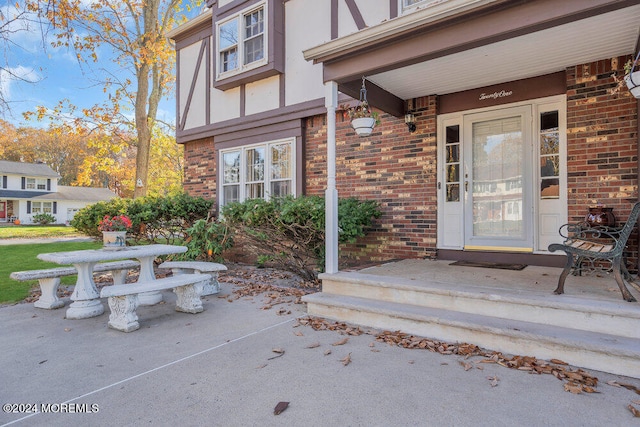 property entrance featuring covered porch