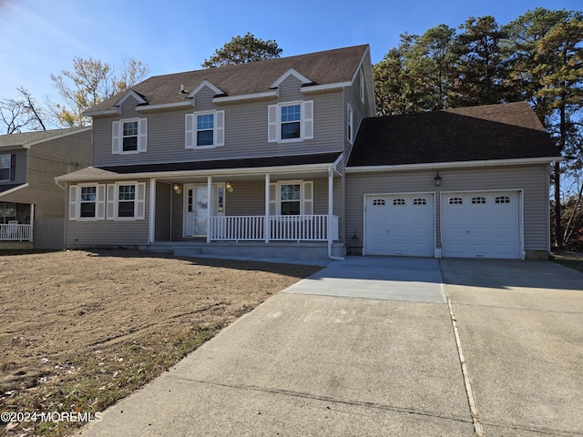 813 Beechmont St, Toms River, NJ 08757 - view of front facade featuring an attached garage, a porch, concrete driveway, and roof with shingles