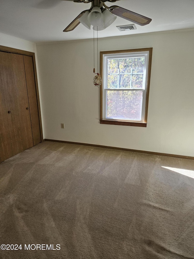 813 Beechmont St, Toms River, NJ 08757 - unfurnished bedroom featuring carpet flooring, a closet, baseboards, and a ceiling fan