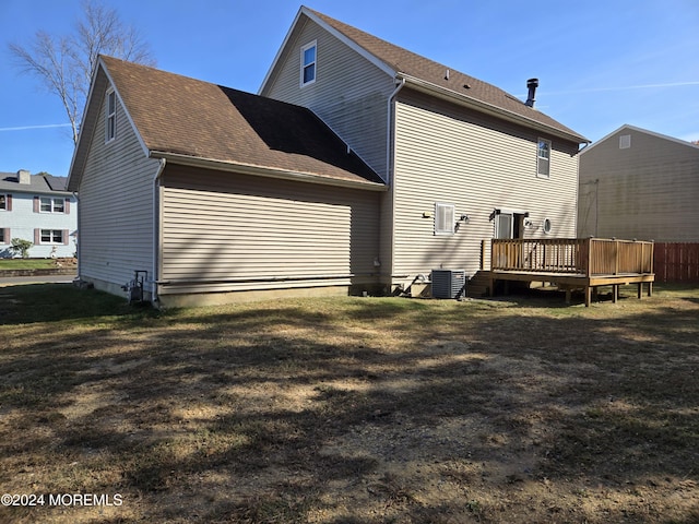 813 Beechmont St, Toms River, NJ 08757 - back of property with a deck, central AC unit, a lawn, and a shingled roof