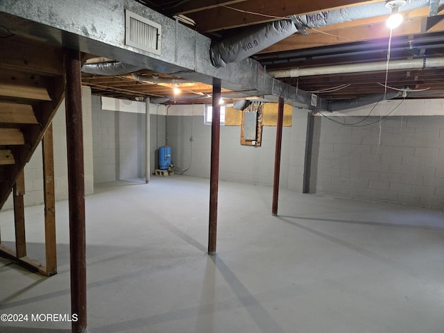 813 Beechmont St, Toms River, NJ 08757 - unfinished below grade area featuring electric panel, stairs, and a water pressure tank