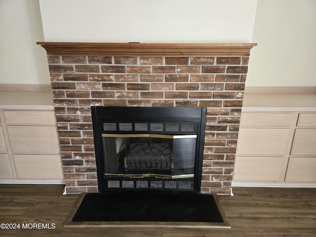 813 Beechmont St, Toms River, NJ 08757 - detailed view of a glass covered fireplace and wood finished floors