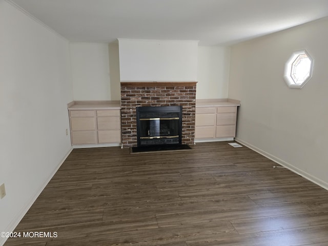 813 Beechmont St, Toms River, NJ 08757 - unfurnished living room featuring a brick fireplace, dark wood-style flooring, and baseboards