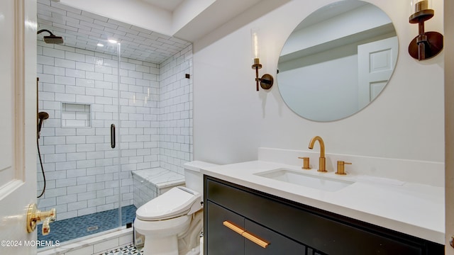 bathroom featuring an enclosed shower, vanity, and toilet