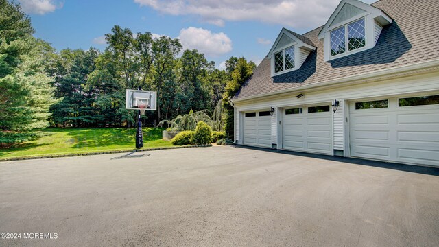 garage featuring a lawn