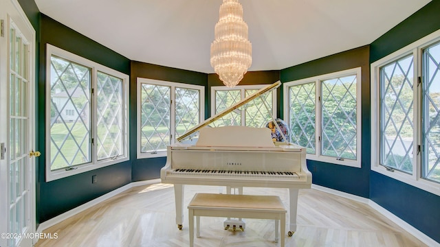 miscellaneous room with a notable chandelier and a healthy amount of sunlight