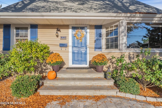 doorway to property with a porch