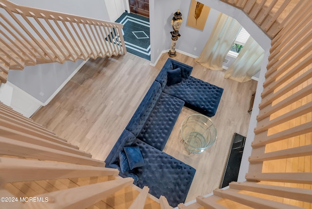 staircase featuring hardwood / wood-style floors