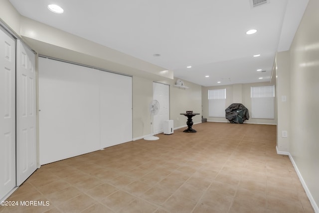 basement with light tile patterned floors