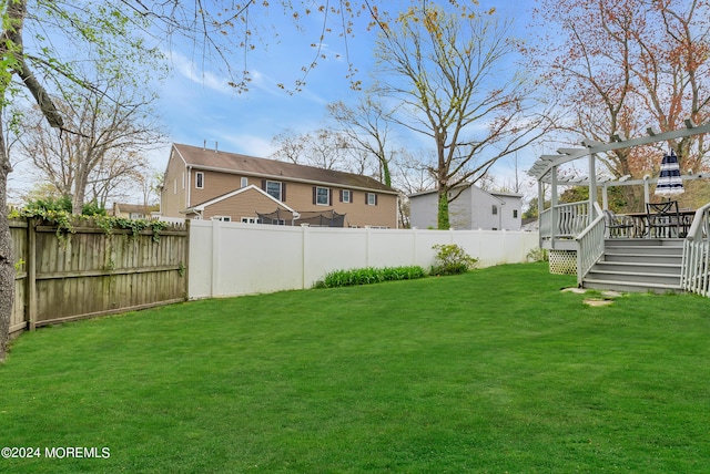 view of yard with a wooden deck