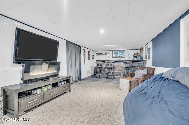 living room featuring bar and carpet flooring