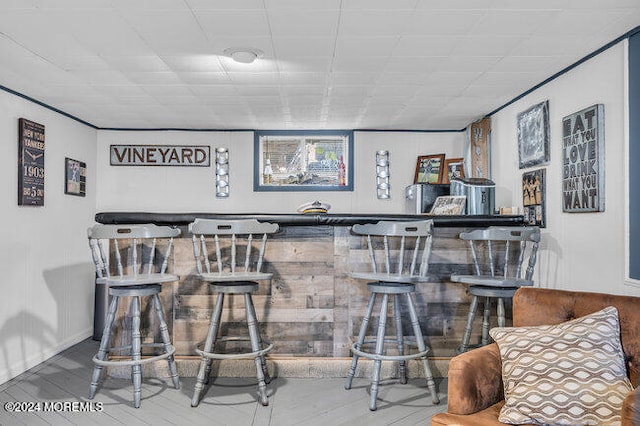 bar with wood-type flooring